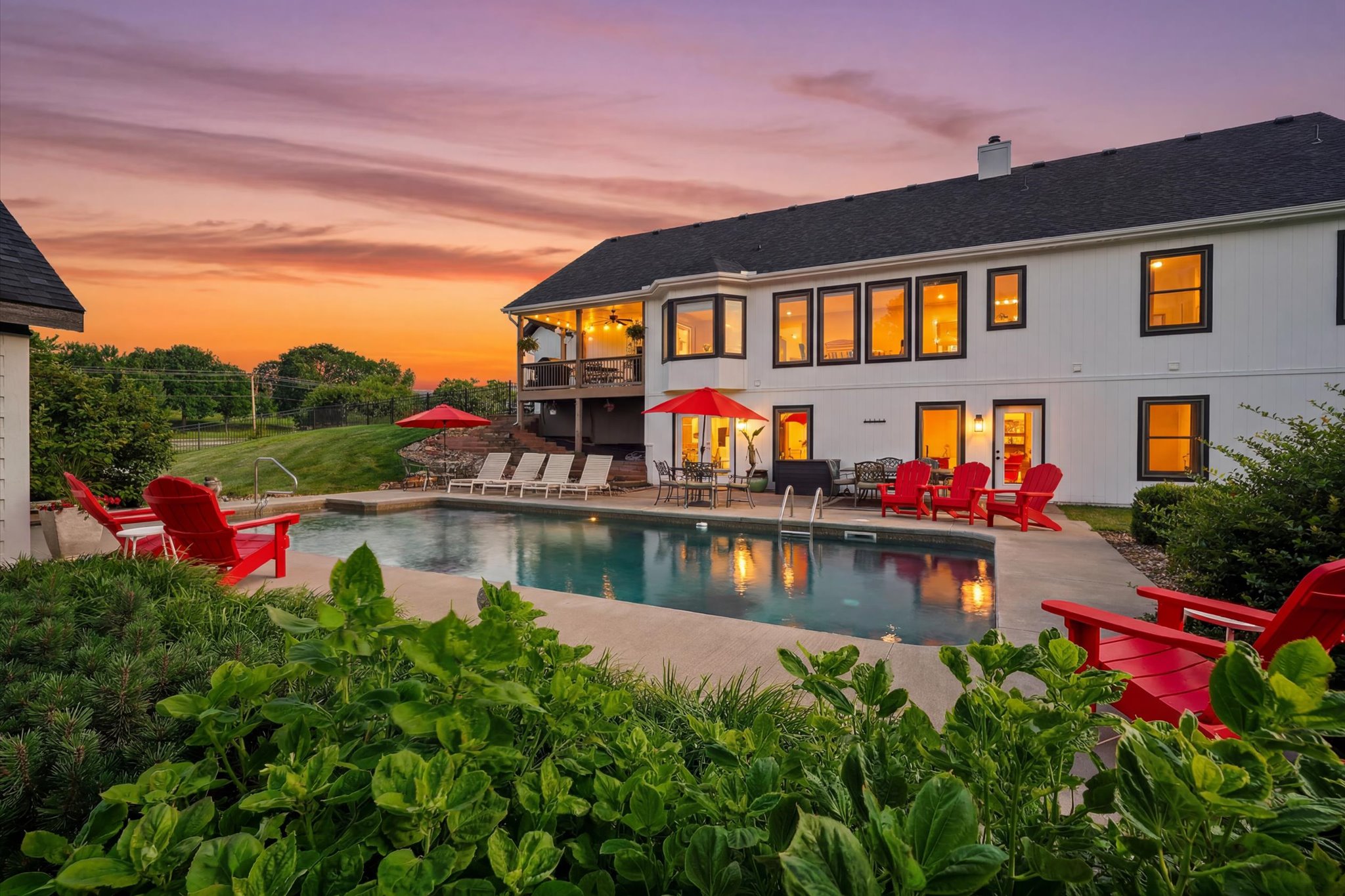 Twilight view of the pool and home at 17224 NE 121st Terrace